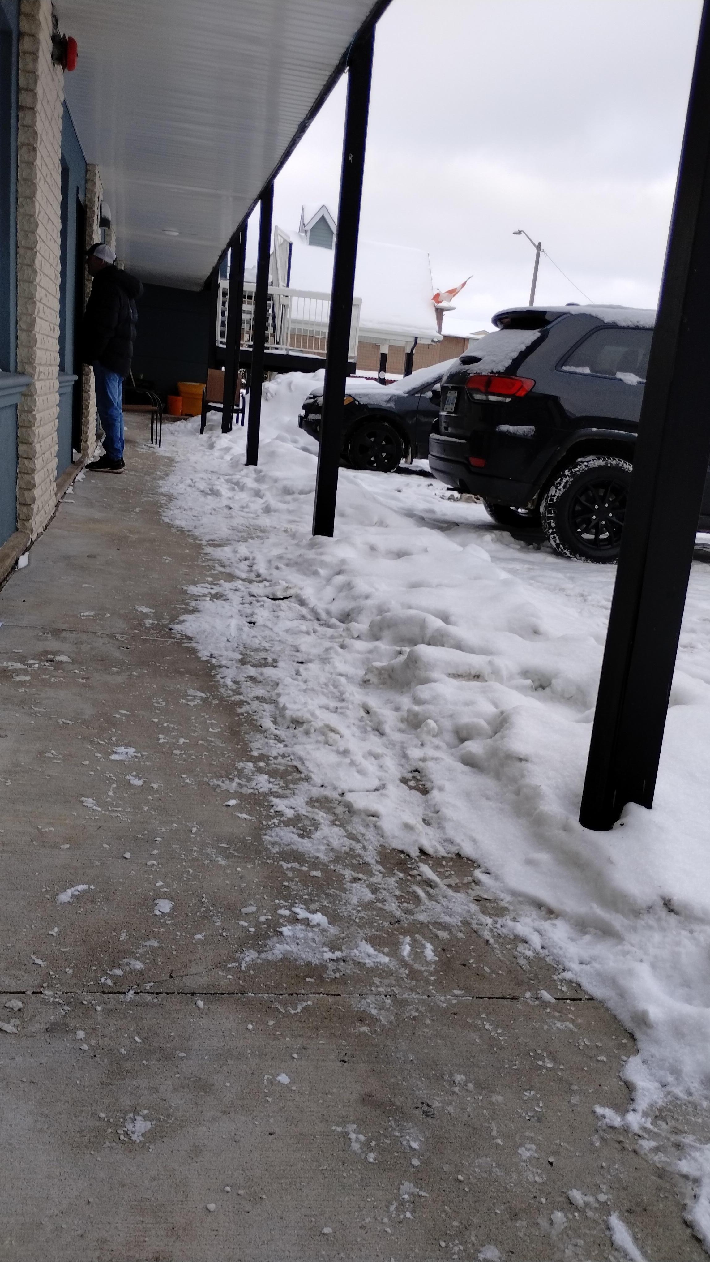 How do they expect people to get over this mound of snow. It was the total length of the walkway to the parking lot 