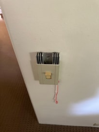 Both of these dimmer units are falling apart; should they finally break further they would pose electrical hazard.