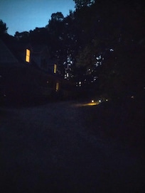 The host house on the left and the short path to the cabin on the right. Close enough to hear a scream!