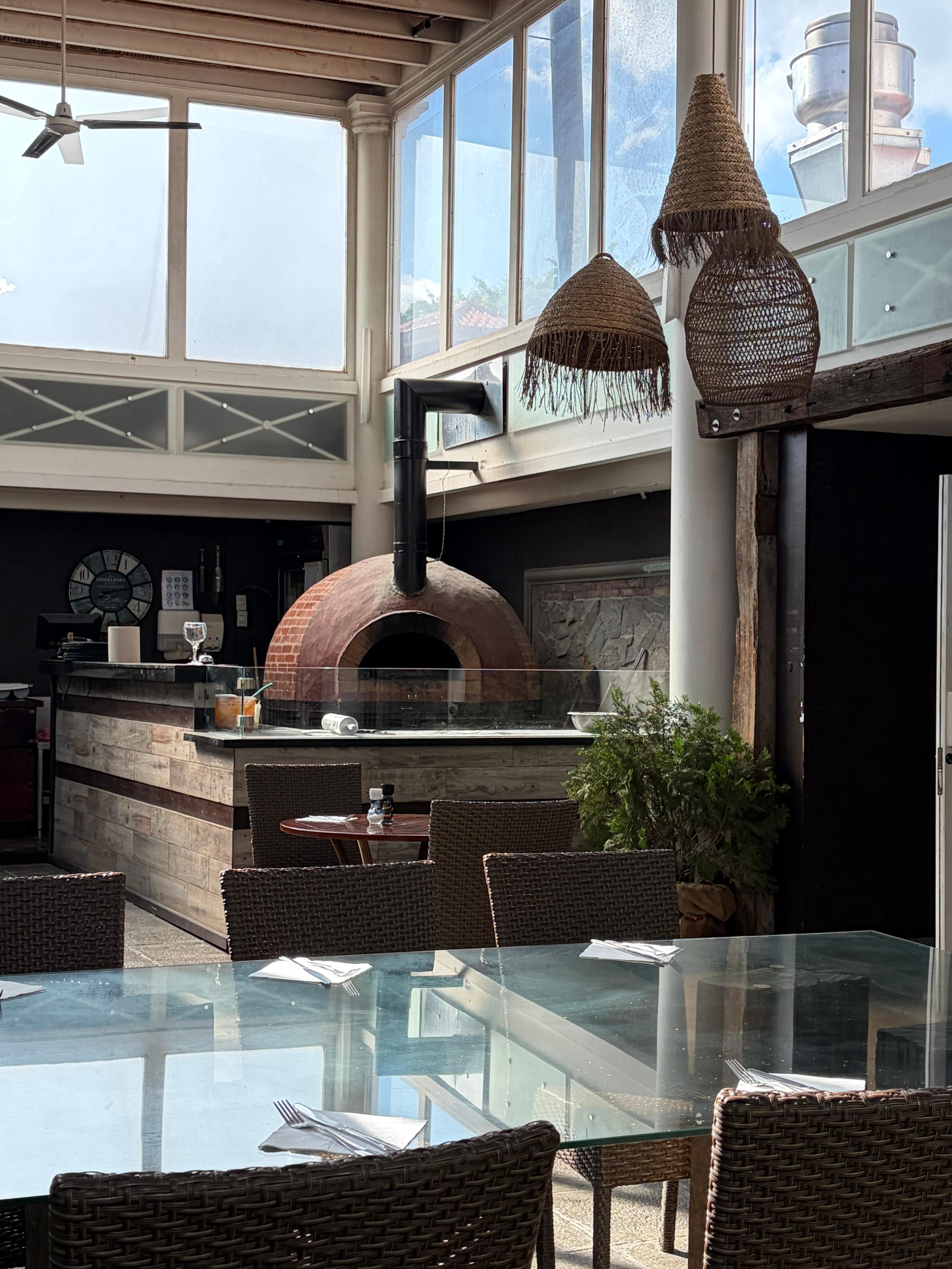 Dining area where pizza is made