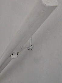 Banister is installed upside-down and is not attached firmly to wall.