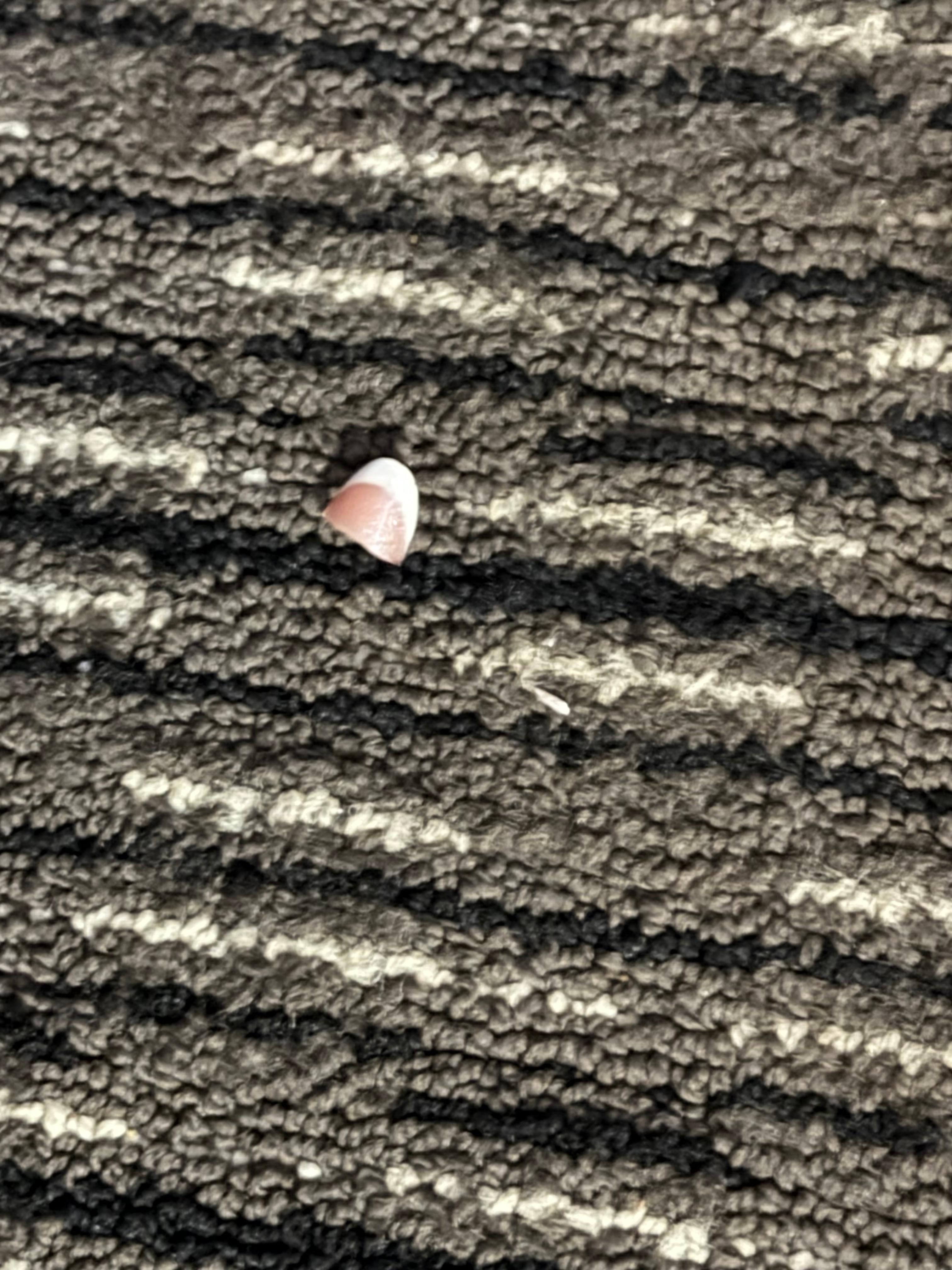 On the floor by the bed! 