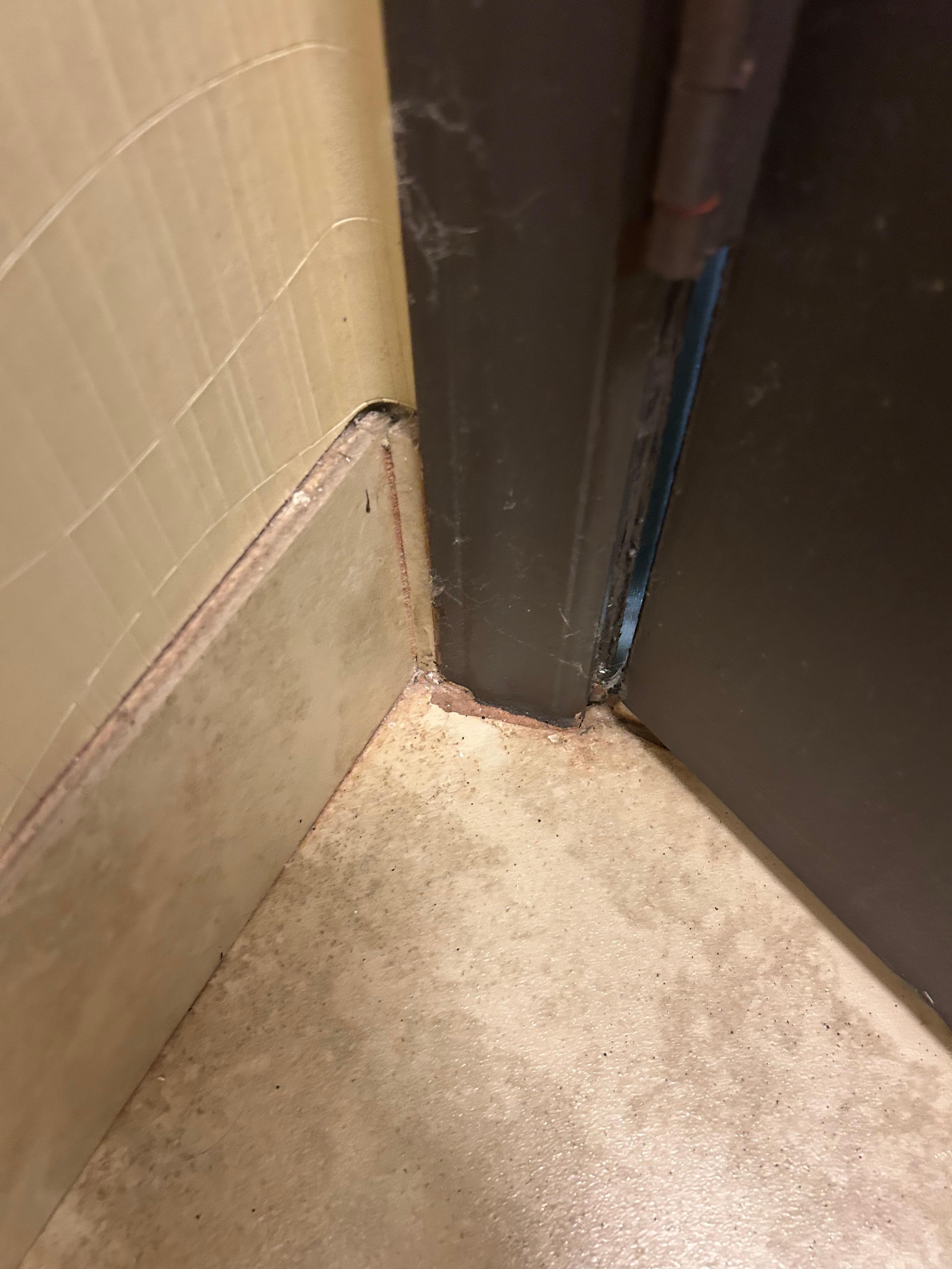 Grungy, rusty moldy grout/floor/mold/tile
