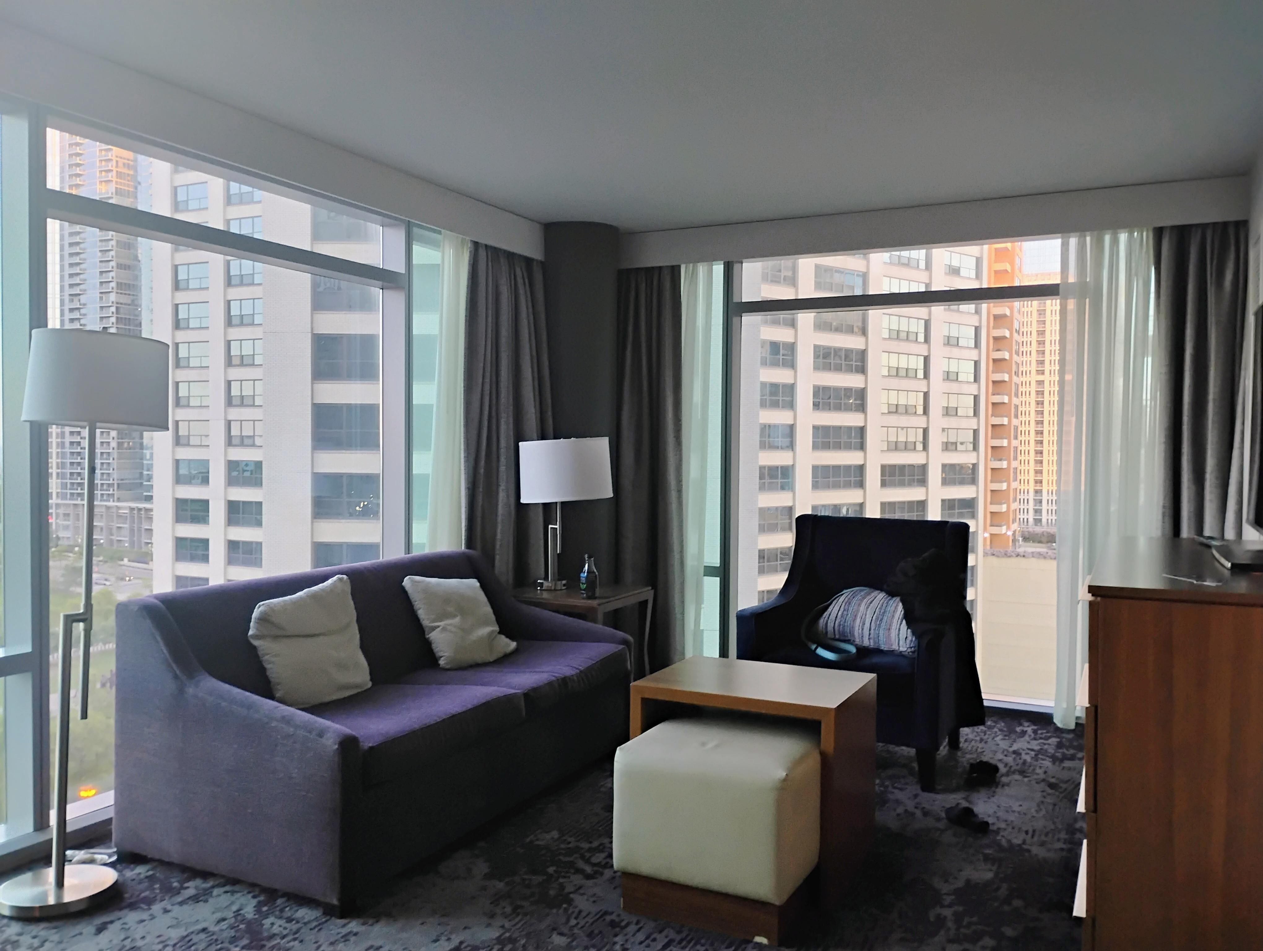 Sitting area with floor to ceiling windows.