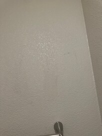 Dirty hand prints on bathroom wall