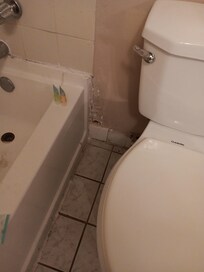 Hole in wall .. only 2 working plugs near the bed.
