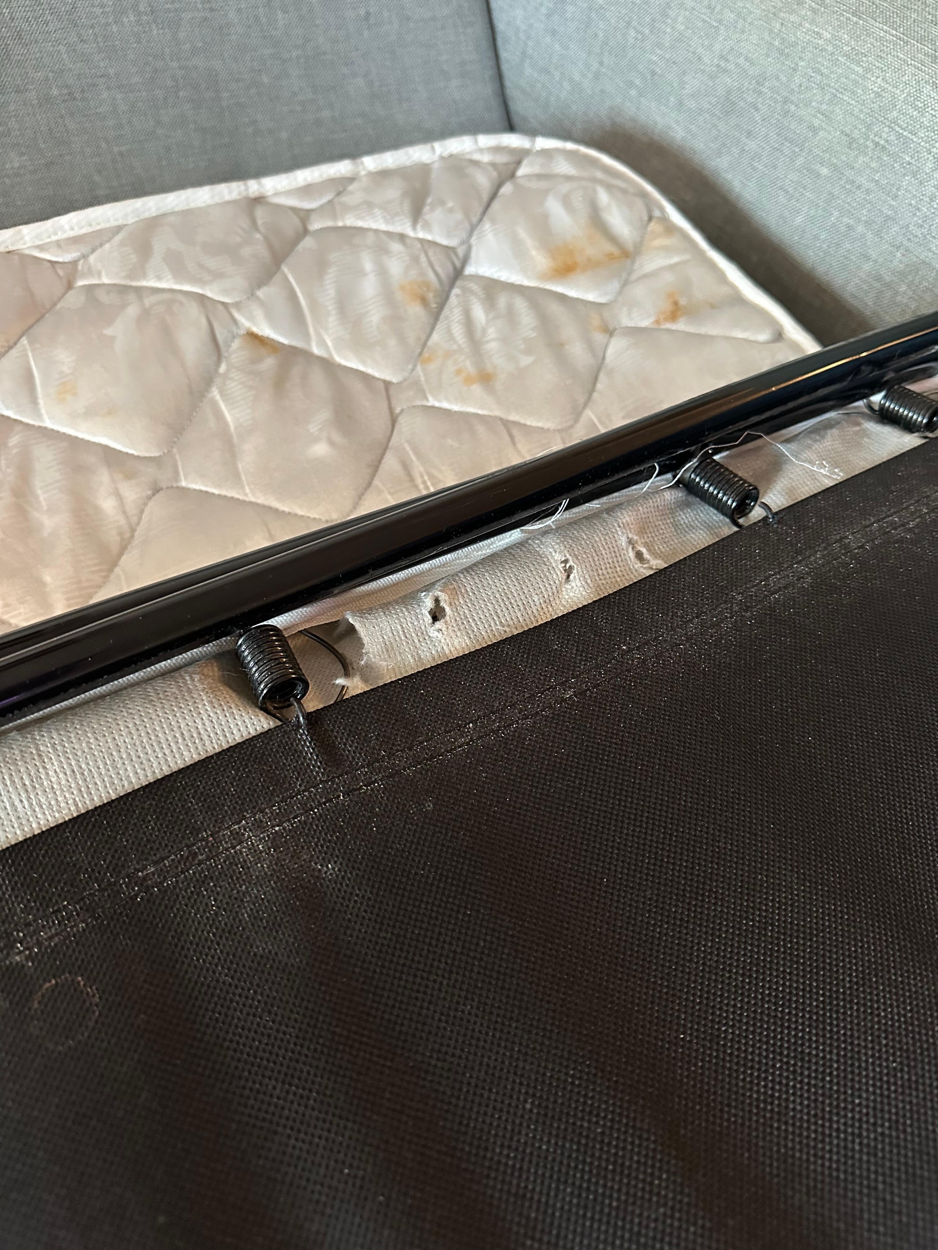 Upper right corner of sleeper sofa stained mattress. 