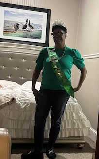 a picture of my play mom on her actual birthday of St. Patrick’s Day in our bed-and-breakfast room.