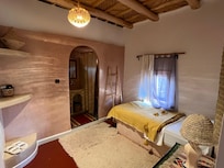 Separate room- connected- by wall- one twin bed