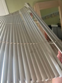 These window shades havenât been cleaned in a long time.