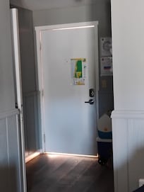 Weather stripping might have helped but the door was at least an inch too short for the frame.