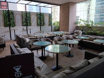 Outdoor restaurant seating near pool