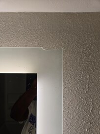 Broken glass mirror in bathroom