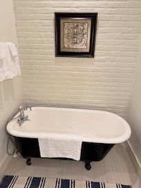 Cute bathtub in our bathroom.