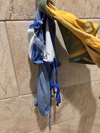 Discoloration from the pool. Green swim suit turned yellew and blue swim suit lost its vibrant color.