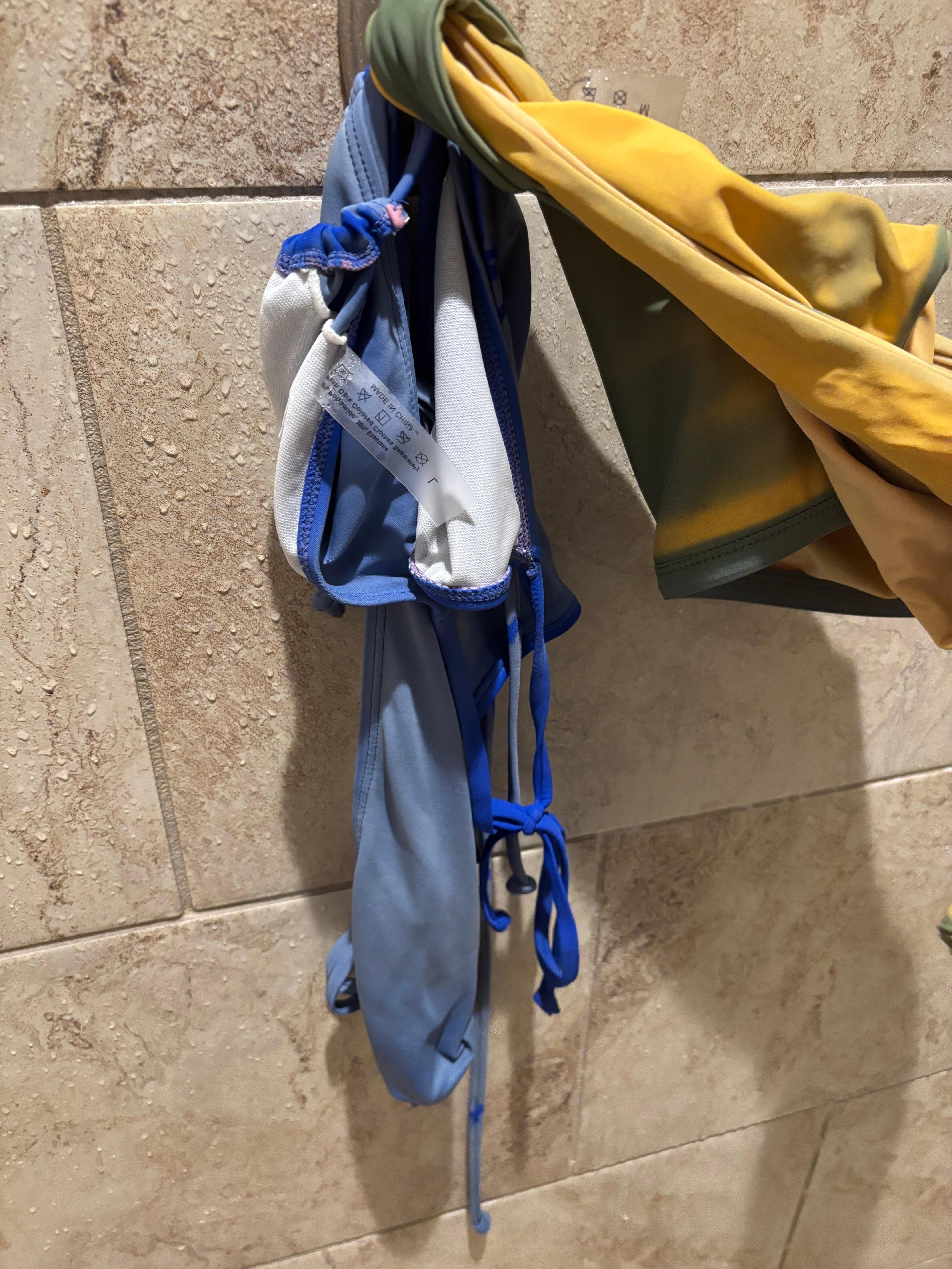 Discoloration from the pool. Green swim suit turned yellew and blue swim suit lost its vibrant color. 