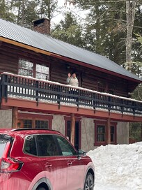 My aunt waving from cabin.