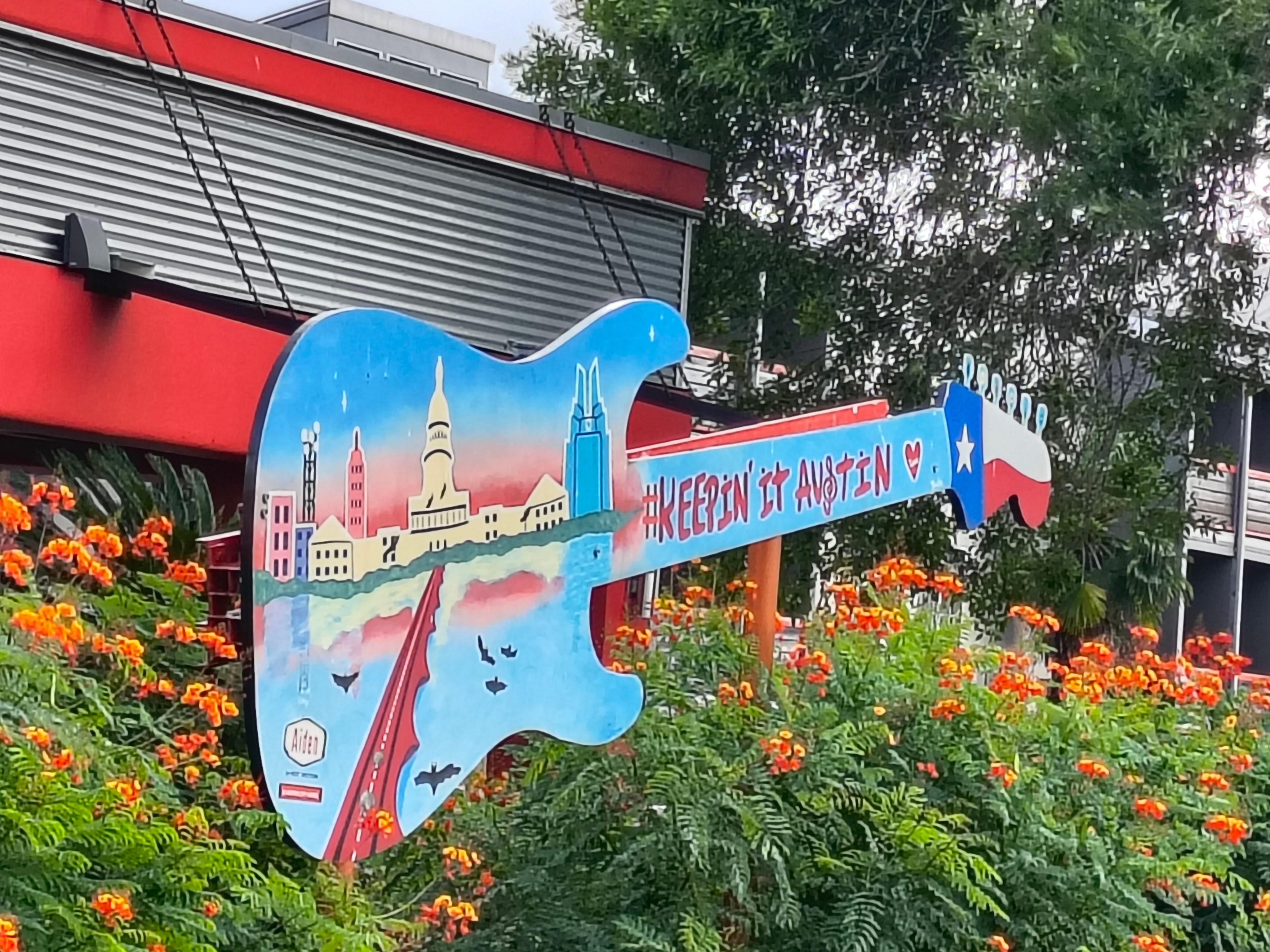 Guitar decoration at front of property