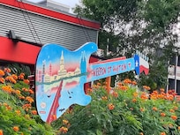 Guitar decoration at front of property