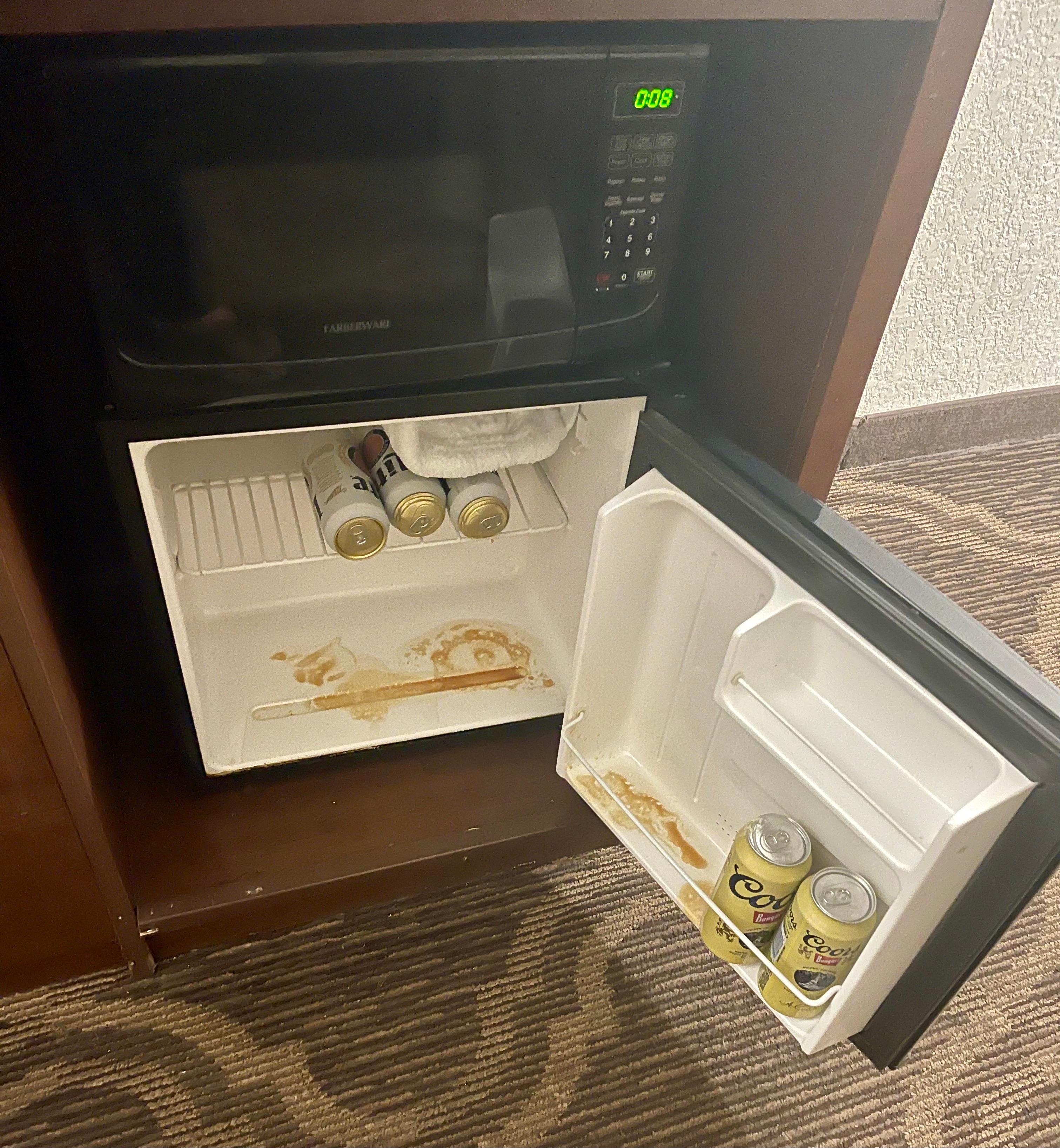 Filthy fridge with beer