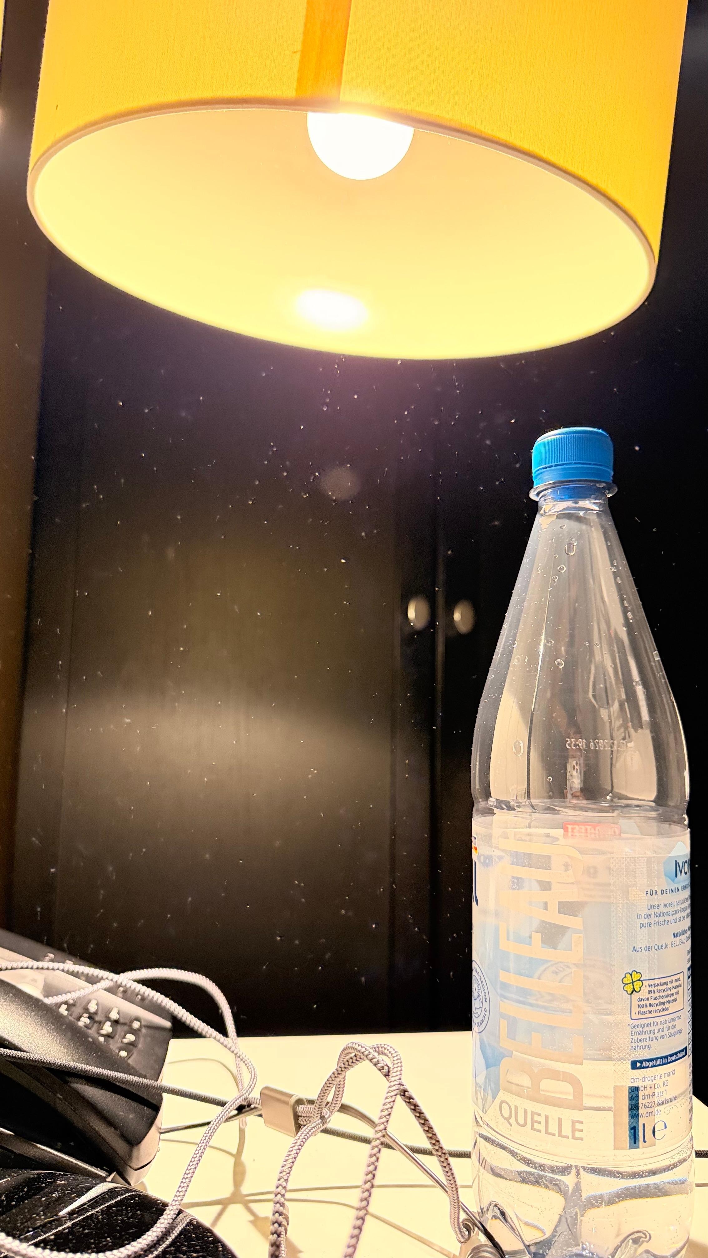 All that flying dust after the water bottle touched the lamp shade