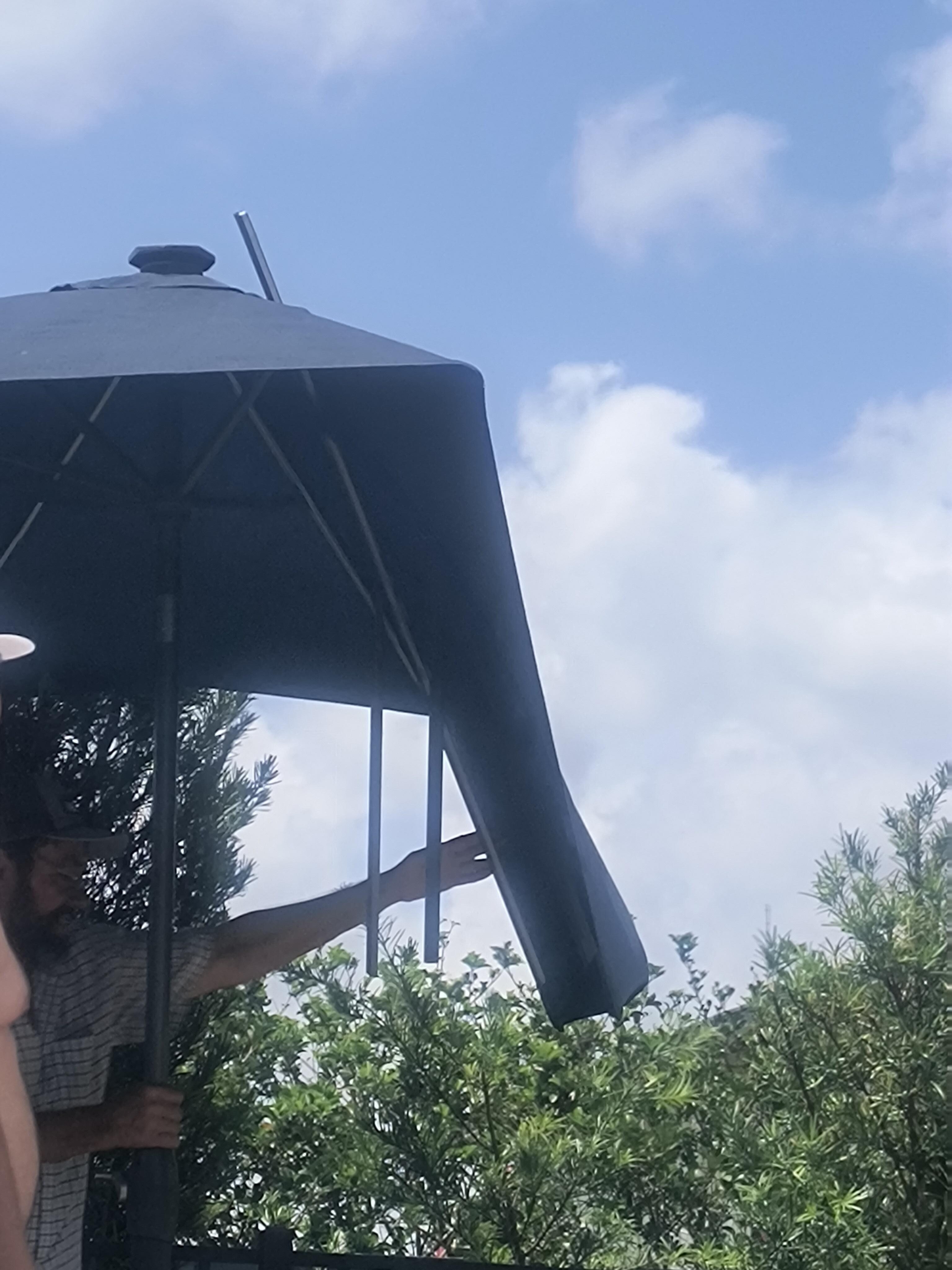The only umbrella that was half-broken. The other was completely broken.