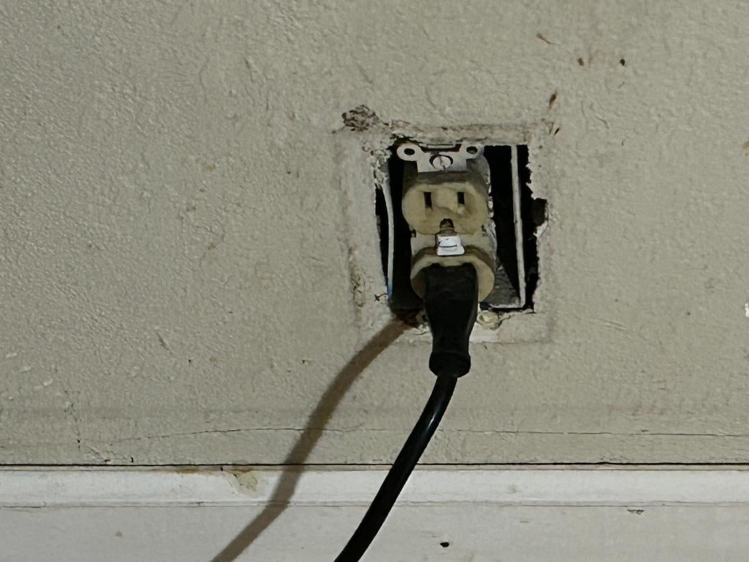 dangerous uncovered wall socket