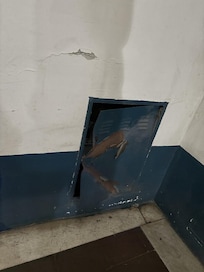 metal panel on the 2nd floor in the stairwell