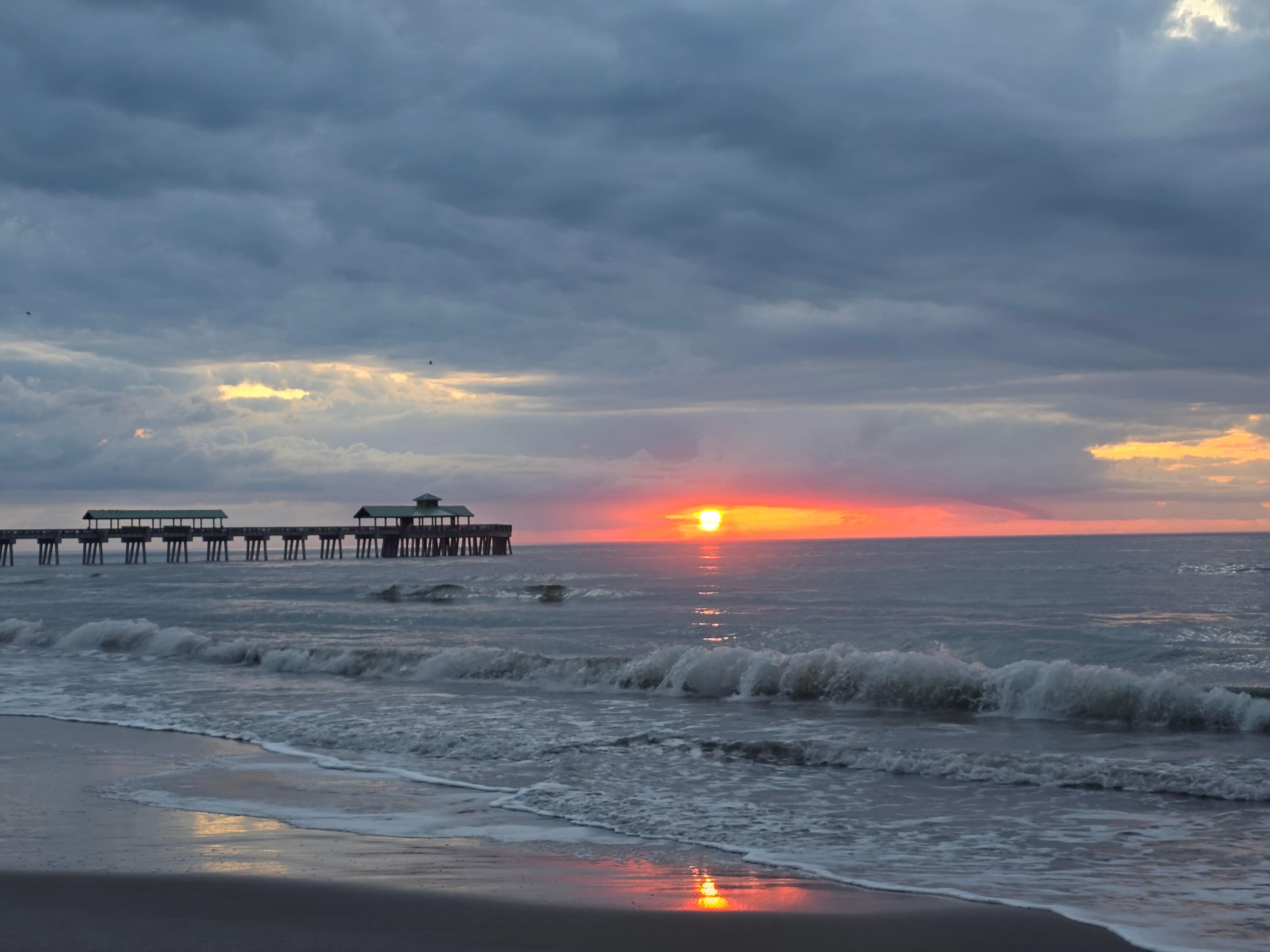 Amazing sunrise overlooking the pier from the beach! 