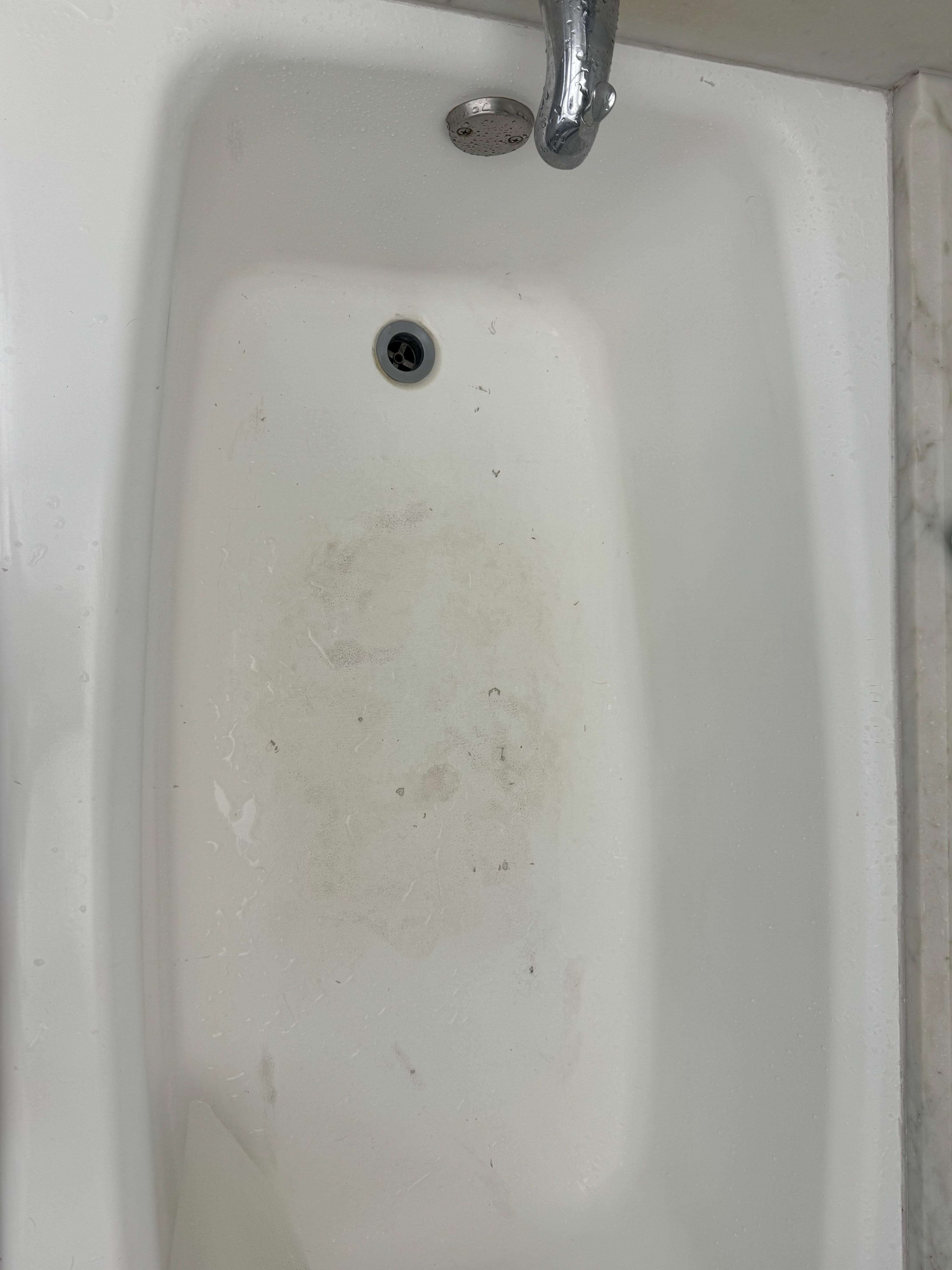 Worn tub and missing drain cover.
