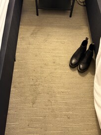 Stains on floor at foot of beds