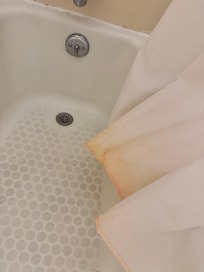 This looked worse in person. It smells musty and moldy, and is completely disgusting.