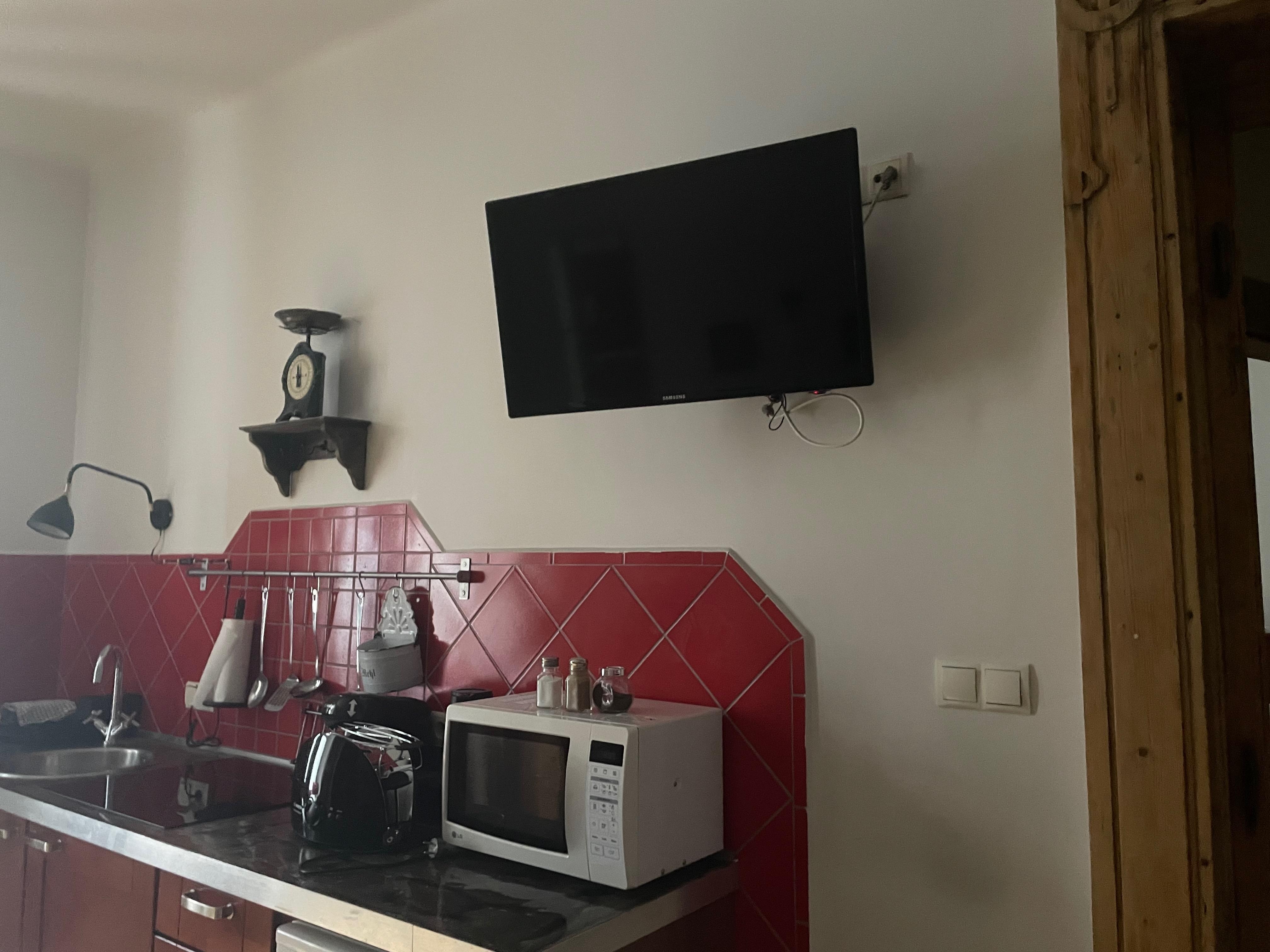 TV mounted as if in a take-away, doesn't feel cosy. Didn't really use owing to lack of English language options