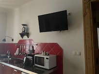 TV mounted as if in a take-away, doesn't feel cosy. Didn't really use owing to lack of English language options