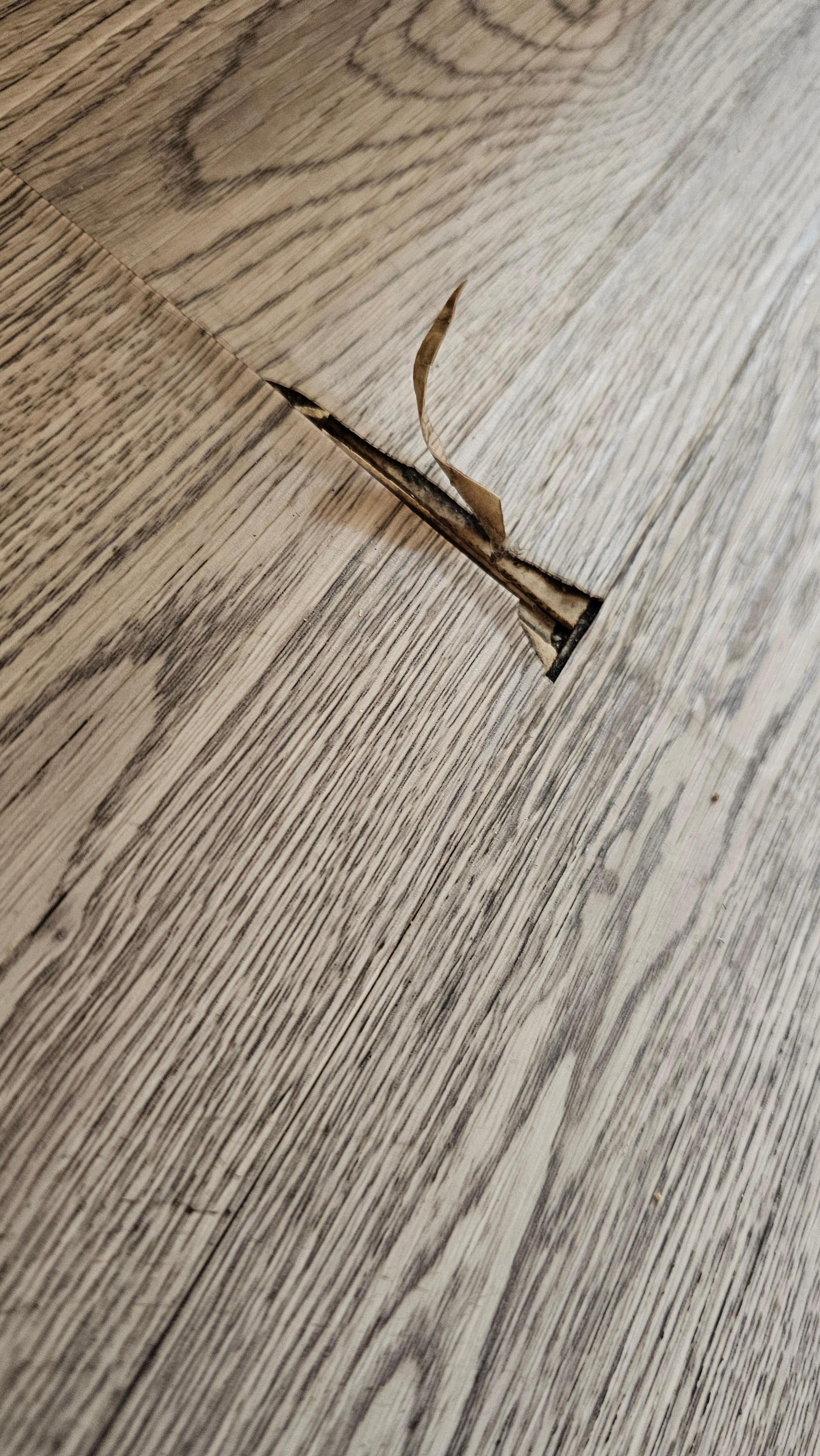 Room vinyl floor coming up all over the room.  Trip hazard & caused black dust all over floor.