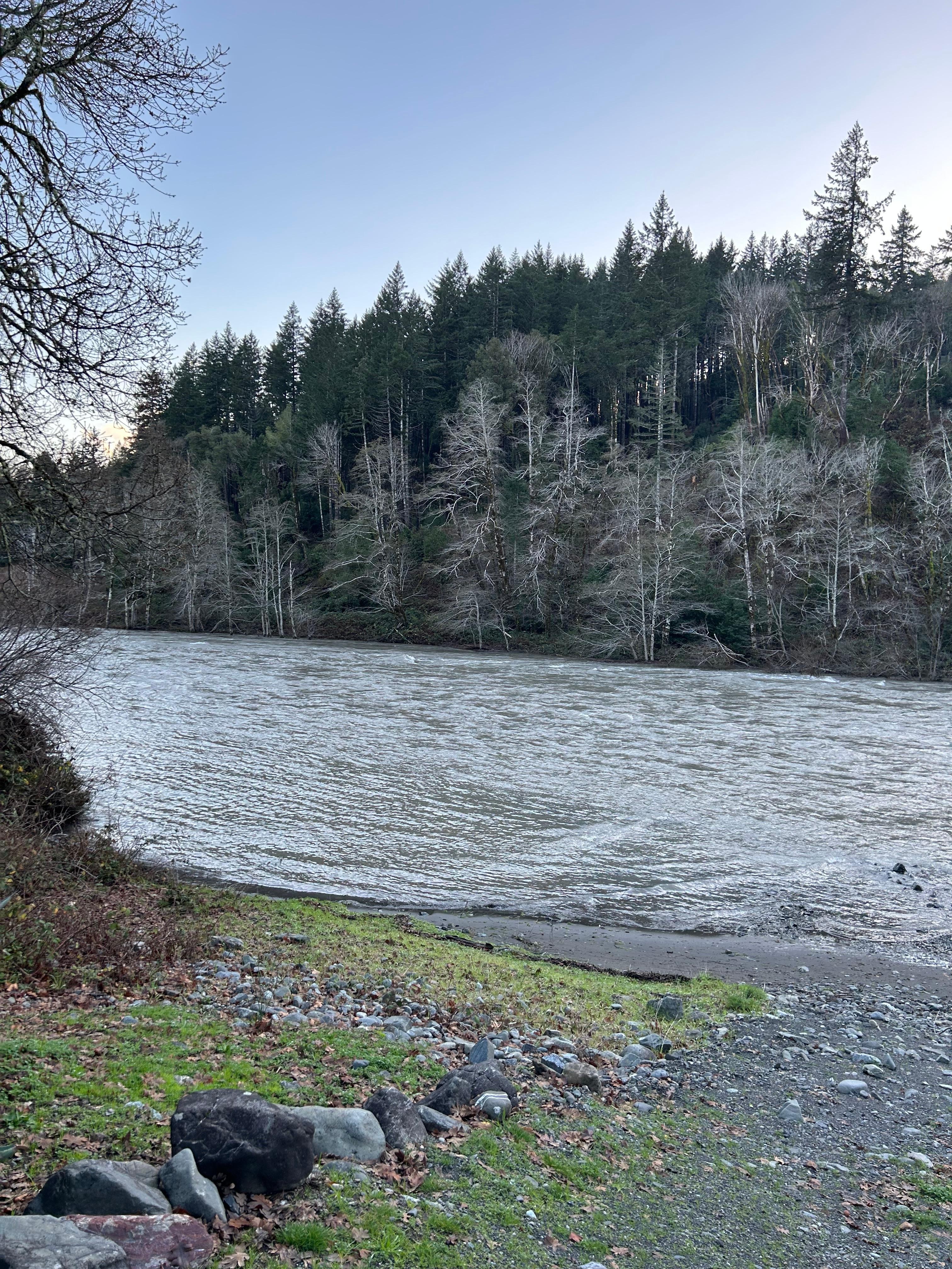 The Chetco River running by the house