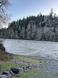 The Chetco River running by the house