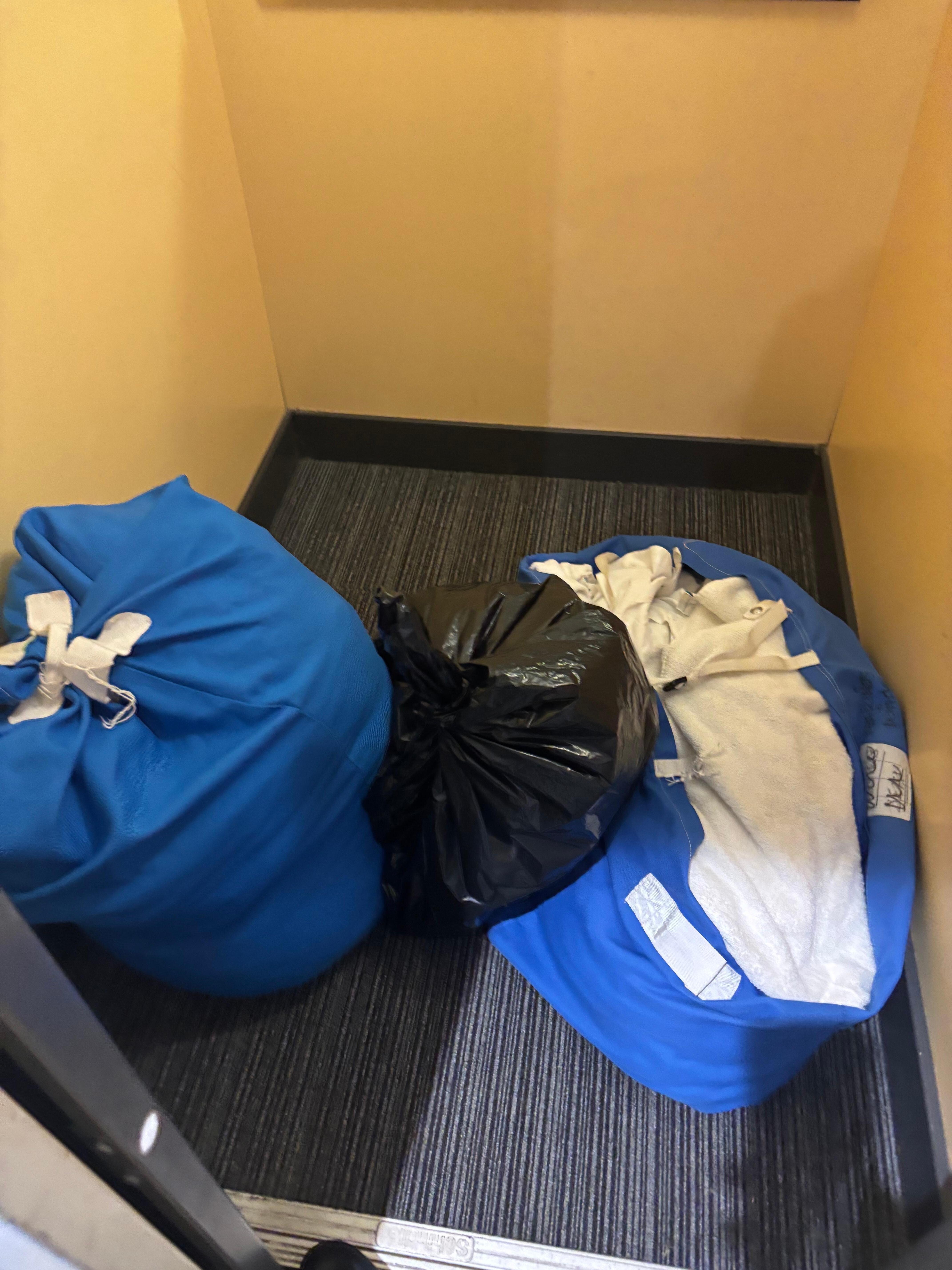 Dirty laundry left in the lift for over a hour 