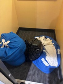 Dirty laundry left in the lift for over a hour