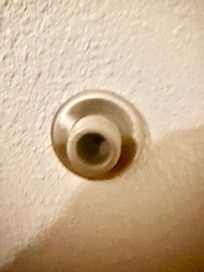 This door knob stopper in the back of the door had a camera in it that camera disappeared
