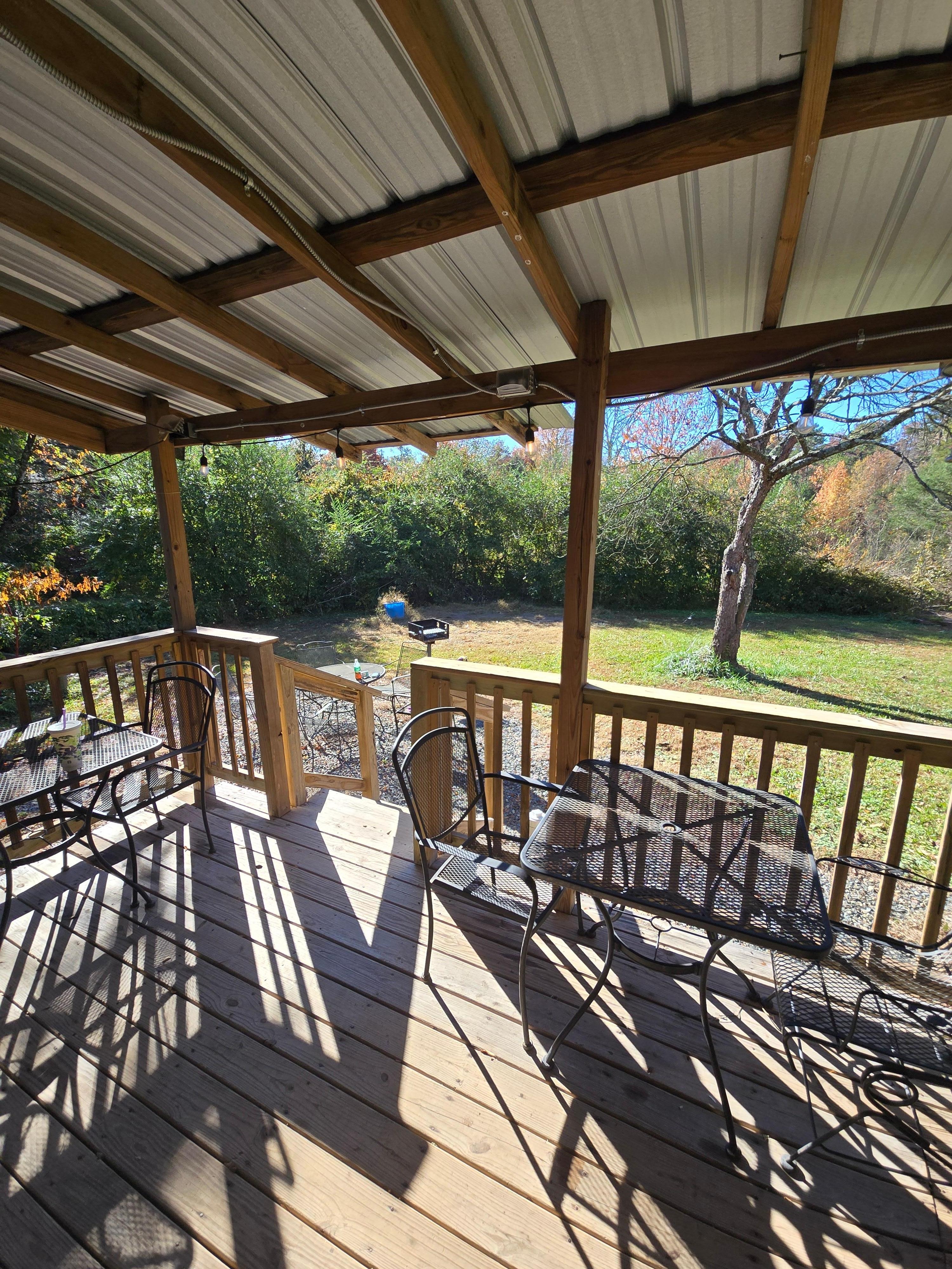 View of the big Back deck with the Hot tub! Very secluded! 