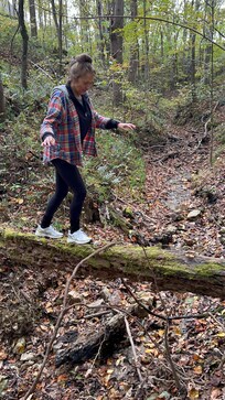 Crossing the creek at the bottom of the hill outside the cabin