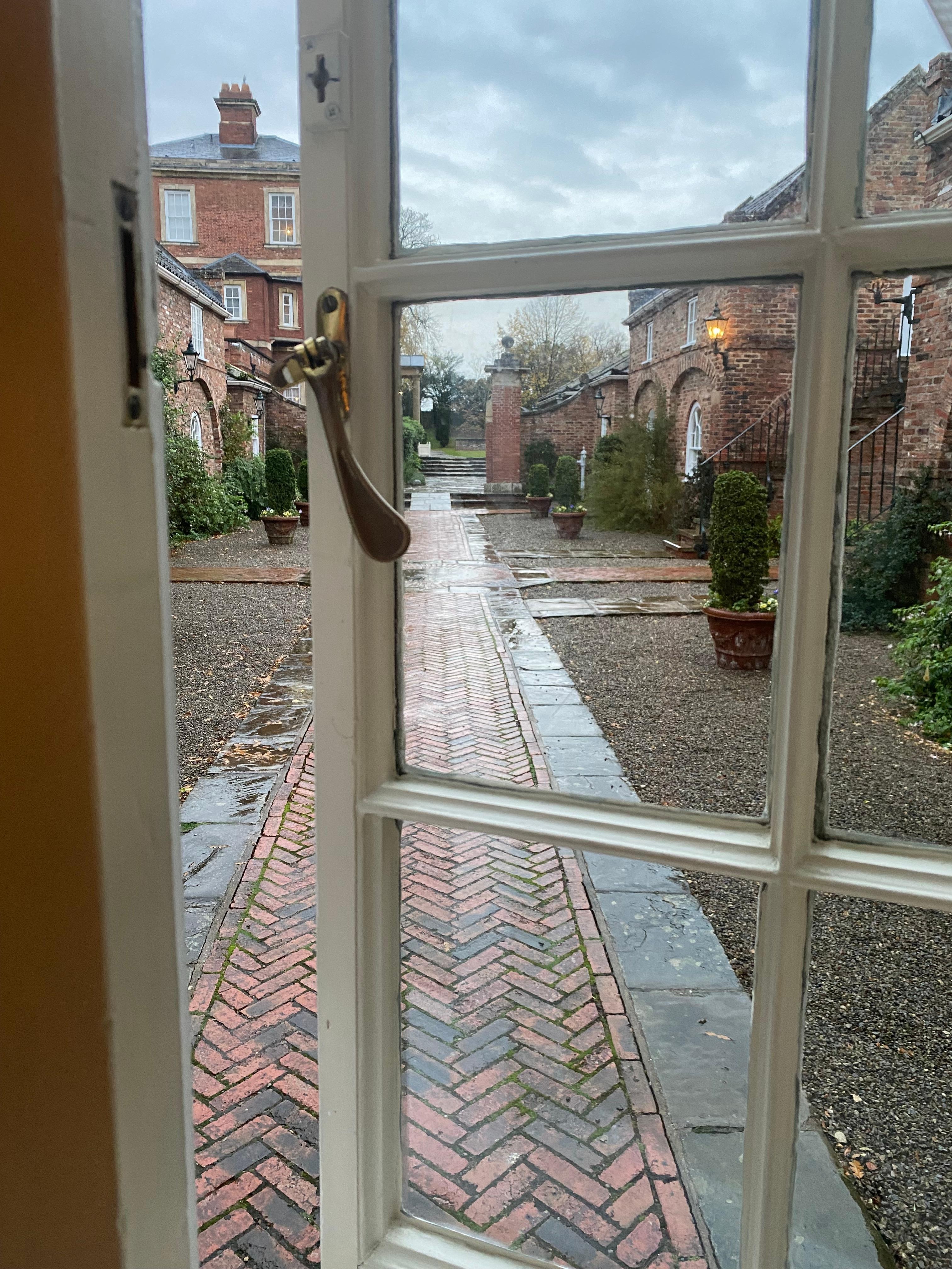 View from my courtyard room adjoining the main house and decorated in calming country cottage style of yesteryear. Delighted.