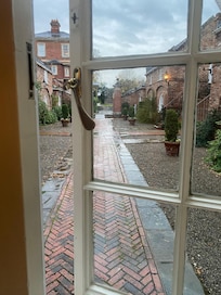 View from my courtyard room adjoining the main house and decorated in calming country cottage style of yesteryear. Delighted.