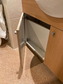 Back panel of under sink unit not replaced to back of wall