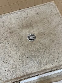 Bottom of stand of shower