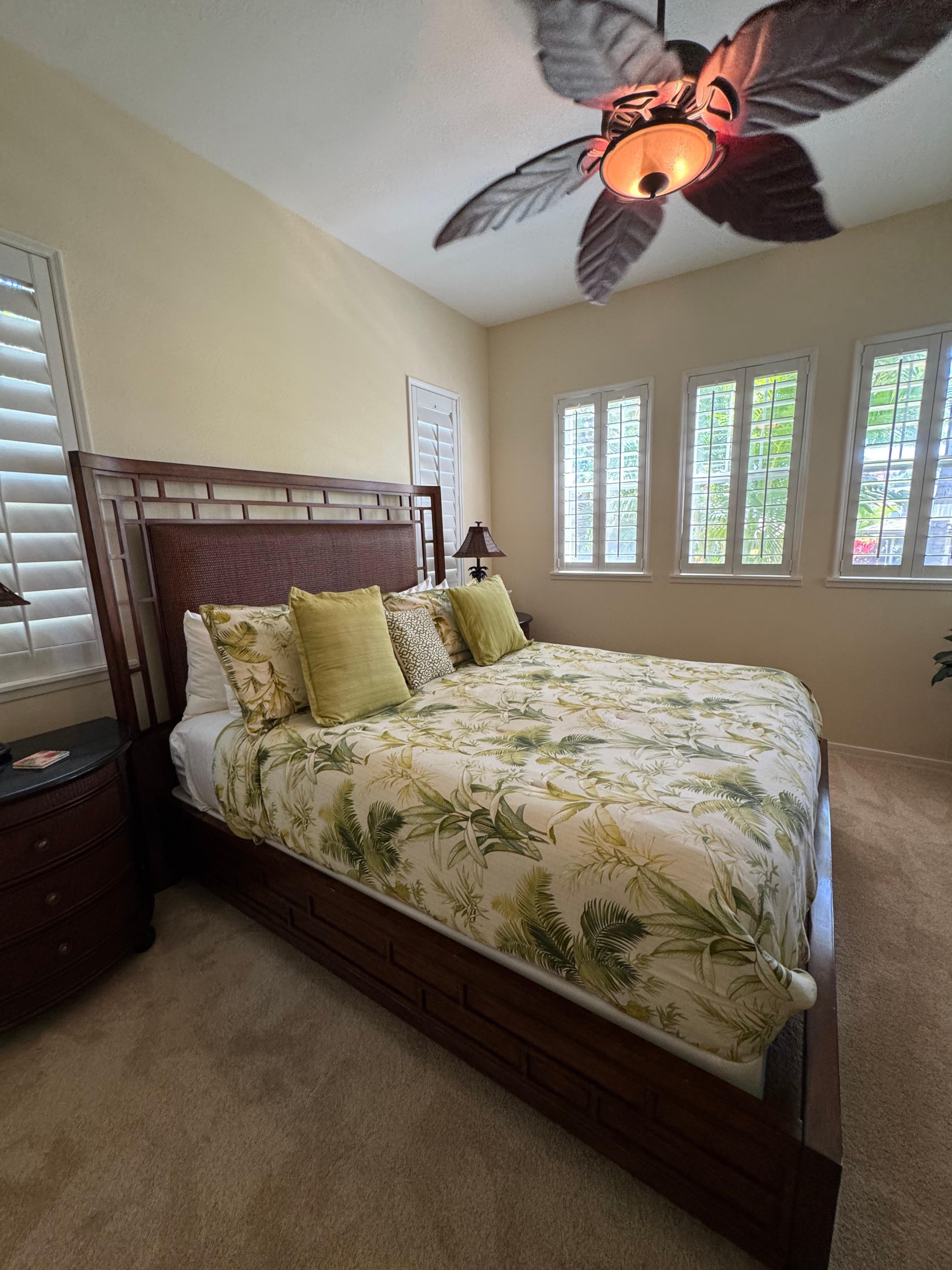 Primary bedroom with tropical view.
