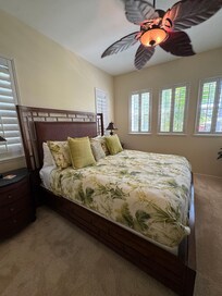 Primary bedroom with tropical view.