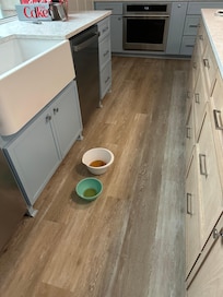 Bowls to catch water from the ceiling leak in the kitchen