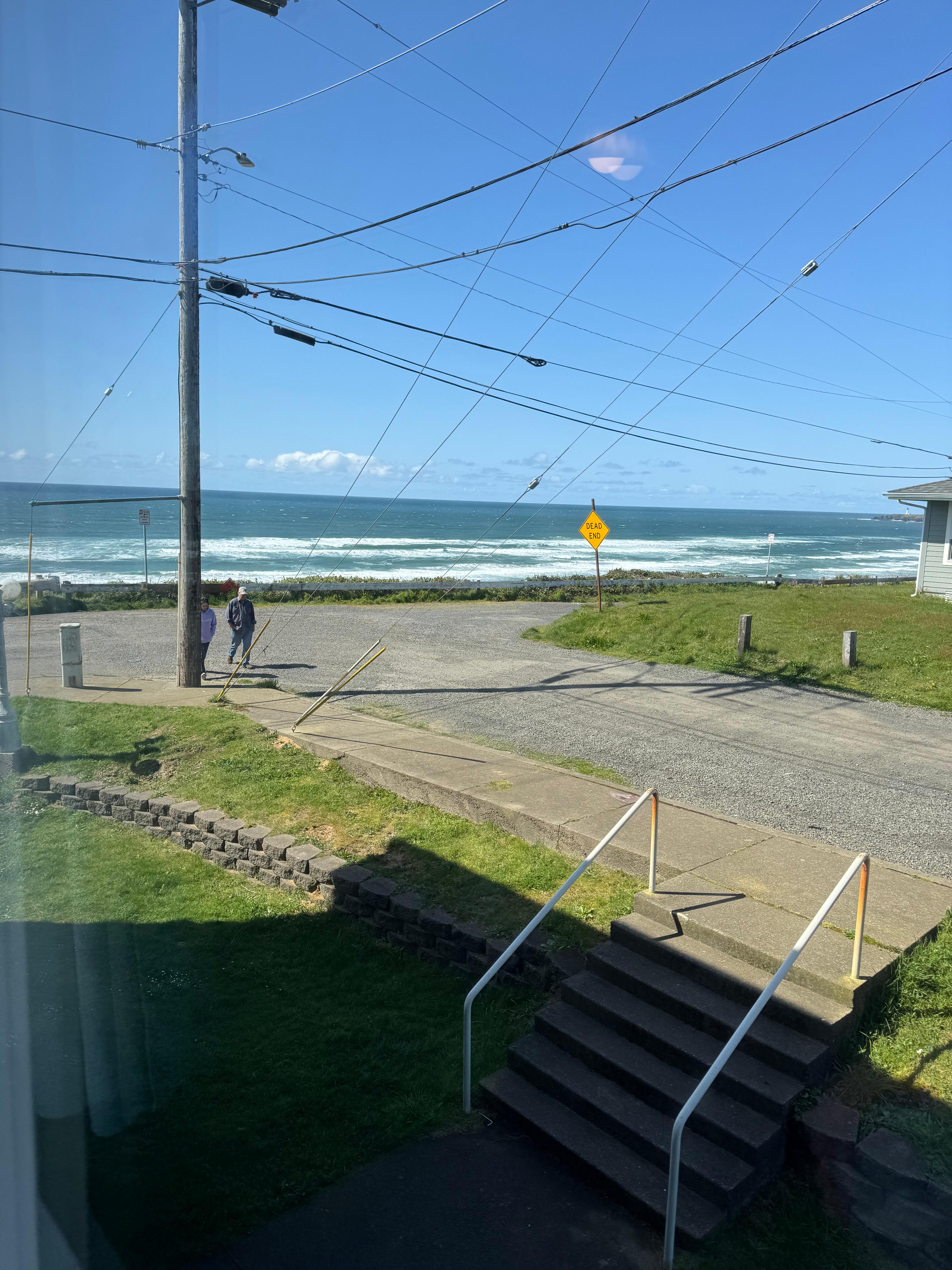 The partial ocean view from our room, Yaquina Head light house in the distance.